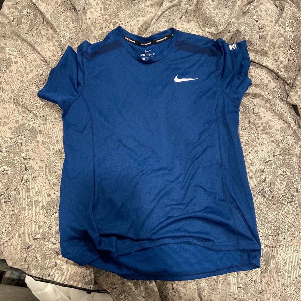 Blue Nike dri fit shirt for athletic wear.